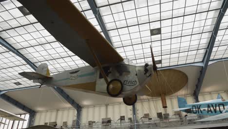 historical-aircraft-exhibition-in-National-Technical-Museum-in-Prague,-Czech-Republic,-showcasing-a-diverse-array-of-airplanes-from-different-eras