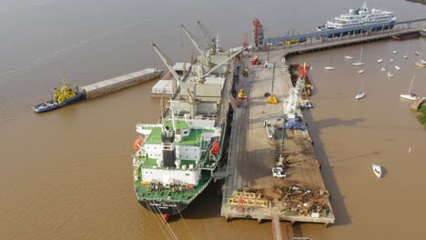 Self-unloading-bulk-carrier-Daiwan-Dolphin-cargo-hatches-open-unloading-sugar-in-port-of-Fray-Bentos
