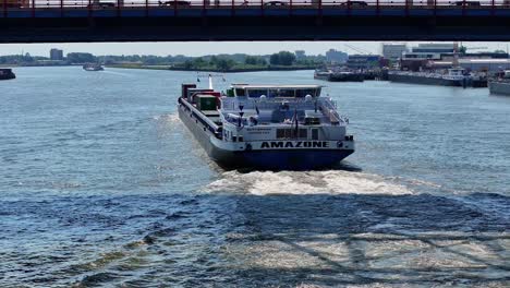 Amazone-Pushtow-Barge-Sailing-In-The-Noord-River-Under-The-Bridge-At-Hendrik-Ido-Ambacht-In-Alblasserdam,-Netherlands