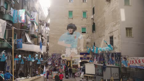 Narrow-street-of-Naples-decorated-with-football-attributes