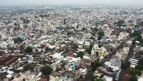 Old-residential-building-with-heavy-traffic-and-congestion-located-in-Old-Rajkot,-Aerial-of-Rajkot-City
