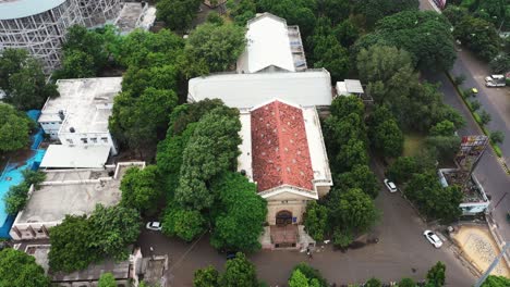 Aerial-view-of-the-Watson-Museum-in-which-the-camera-moves-from-the-front-view-to-the-back-and-the-entire-museum-is-visible-in-the-aerial-camera