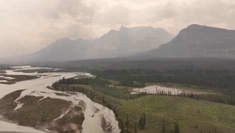 Forest-fire-smoke-obscures-the-Rocky-Mountains-along-the-North-Saskatchewan-River-in-Alberta,-Canada
