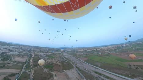 balloon-trip-over-cappadocia-turkey,-colorful-air-balloons,-drone