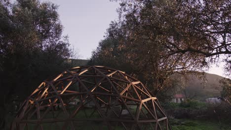 Wide-shot-of-wooden-hexagonal-geodome-structure-outdoors