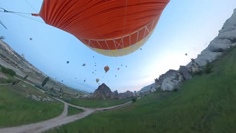 balloon-trip-over-cappadocia-turkey,-colorful-air-balloons,-capadocia,-tour