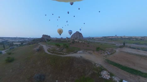 balloon-trip-over-cappadocia-turkey,-colorful-air-balloons,-balloon-ride