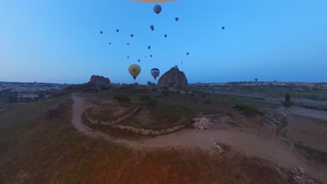 balloon-trip-over-cappadocia-turkey,-colorful-air-balloons,-hot-air-balloon-ride