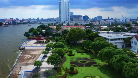 Green-Landscape-Of-An-Urban-Park-Near-Rivershore-Of-Chao-Phraya-River-in-Bangkok,-Thailand