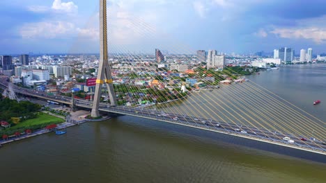 Rama-VIII-Bridge-Over-Chao-Phraya-River-In-Bangkok,-Thailand---aerial-drone-shot
