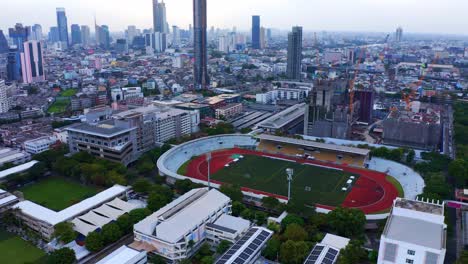 Aerial-Drone-View-Of-Chulalongkorn-University-Stadium-In-The-City-Of-Pathumwan-Bangkok,-Thailand
