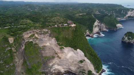 White-smooth-sea-cliffs-of-paluang-and-hidden-sea-cave-coves,-aerial-panoramic-overview