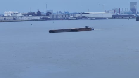Port-of-Moerdijk:-Cargo-Ship-Sailing,-Drone-View