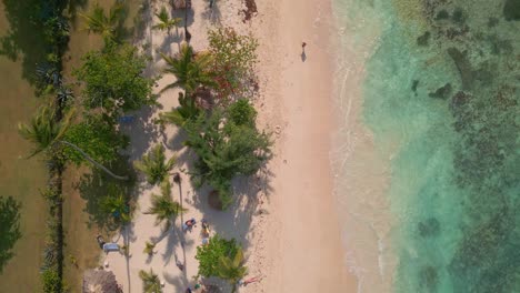 Vertical-format-of-La-Playita-beach-at-Las-Galeras-in-Samana-peninsula,-Dominican-Republic