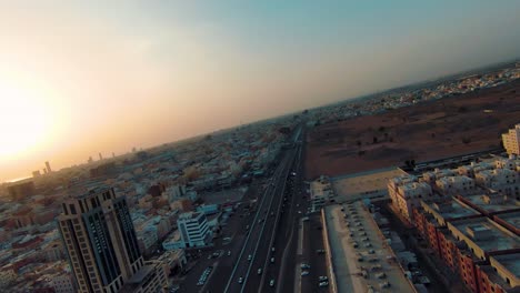 FPV-Drone's-Cinematic-Turn-Highlights-the-Busy-Roads-of-Jeddah-with-a-Setting-Sun