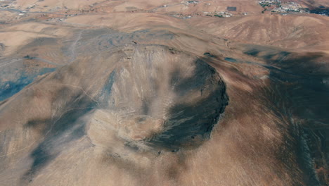 Gairia-volcanic-caldera:-aerial-shot-over-the-crater-of-the-volcanic-caldera-on-a-sunny-day-with-beautiful-orange-colors