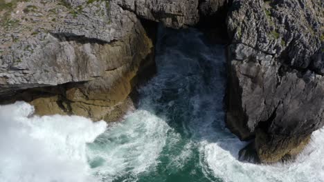White-wash-crashing-from-wave-on-sea-cliff-chasm-at-bufones-de-pria-asturias-spain