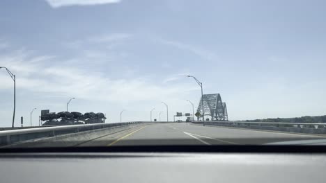 driving-plate,-view-of-a-car-approaching-a-bridge