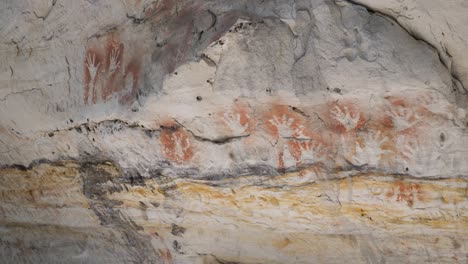 Aboriginal-rock-art-paintings-displaying-stories-of-dreamtime-on-ancient-cave-walls-from-indigenous-Australian-first-nation-people