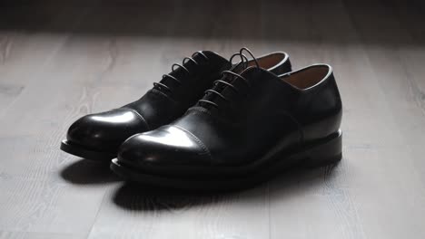 Close-Up-Shot-Of-Black-Formal-Shiny-Shoes-Placed-For-Wedding-Ceremony