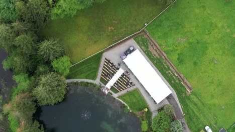 Aerial-view-from-drone-of-a-farm-with-a-lake