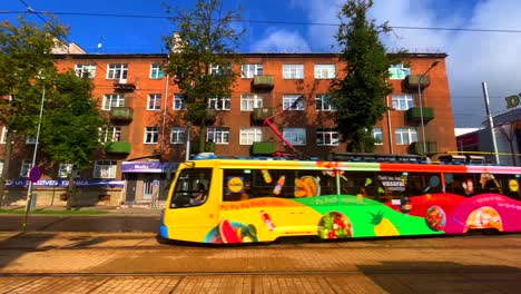 Tram-from-Belarus-passing-by-in-Daugavpils-street-on-a-sunny-summer-day