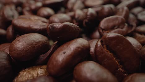 Lighting-changes-over-a-macro-shot-of-a-pile-of-coffee-beans