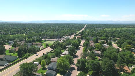 Aerial-Drone-flyover-of-cars-driving-in-Neighborhood-of-Centennial,-Colorado,-outside-of-Denver-Colorado-during-the-summertime