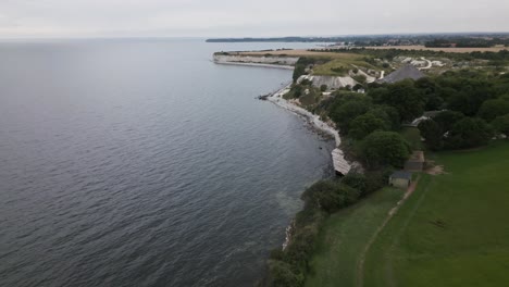 drone-flight-along-some-cliffs-at-the-sea-in-denmark-with-birds
