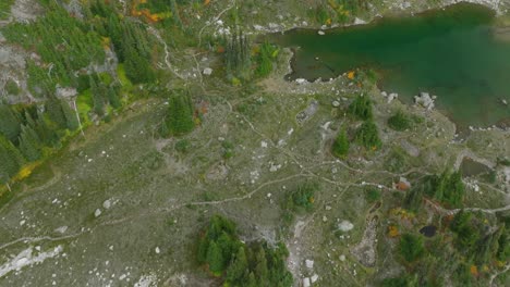 Aerial-drone-footage-of-alpine-lakes-in-a-mountain-range