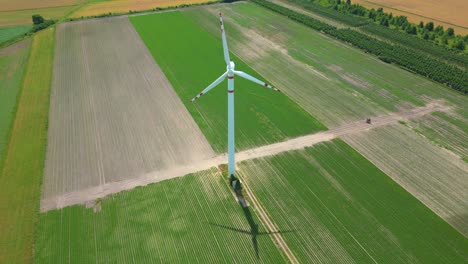 Panoramic-view-of-wind-farm-or-wind-park,-with-high-wind-turbines-for-generation-electricity-with-copy-space