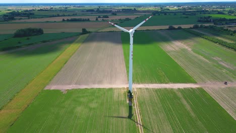 Panoramic-view-of-wind-farm-or-wind-park,-with-high-wind-turbines-for-generation-electricity-with-copy-space