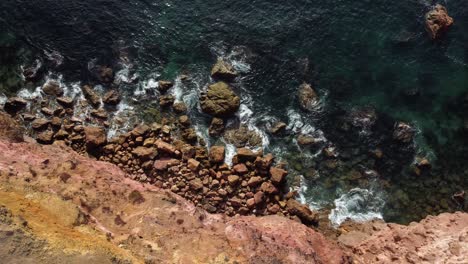 topdown-view-along-Rocky-coastline-with-atlantic-ocean,-Algarve