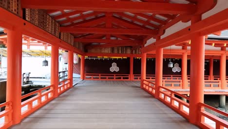 Walking-along-an-Alley-path-of-the-famous-shitno-temple-on-Miyashima,-Japan