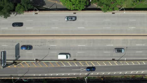 Overhead-of-traffic-flow-on-6-lane-highway,-60fps