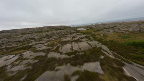 Drone-flight-over-rocky-terrain-of-Ramsvik-in-Sweden