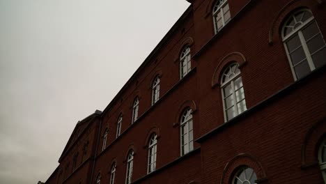 old-brick-building-with-large-windows-in-Germany-with-an-overcast-sky