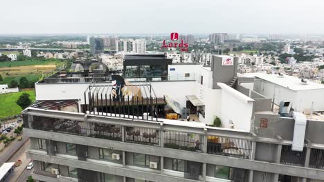 Aerial-fixed-view,-open-terrace-garden-on-the-top-floor-of-a-high-rise-building