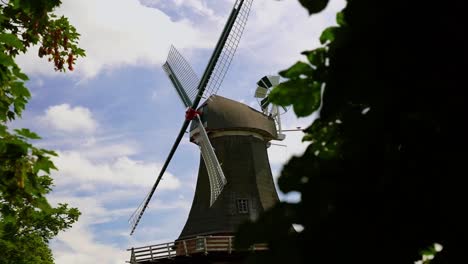 High-quality-shot-of-a-historic-beautiful-windmill-in-Holland-near-the-sea-in-good-weather