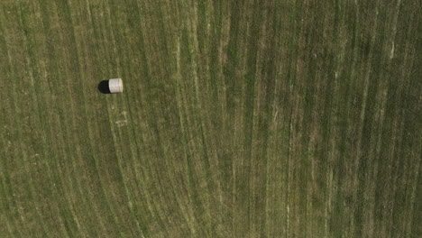 Bird's-Eye-View-Over-Field-With-Round-Bale-In-Oronoco,-Minnesota,-USA---drone-shot