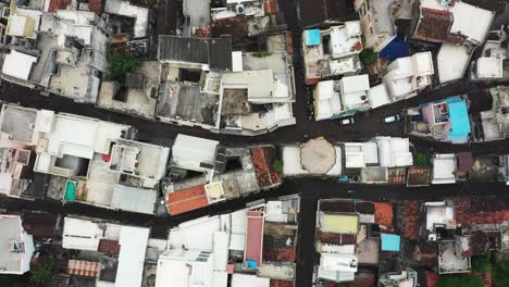 Aerial-topdown-view,-aerial-drone-camera-moving-over-the-old-city-showing-narrow-streets-and-very-old-houses