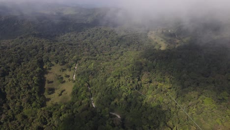 Aerial-drone-footage-flying-close-to-the-clouds-over-a-tropical-rainforest-in-Costa-Rica,-Monteverde