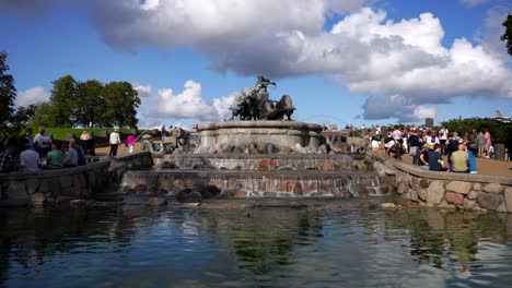 Crowded-Gefion-Fountain-with-water-running-into-a-pond-in-Kastellet,-Copenhagen