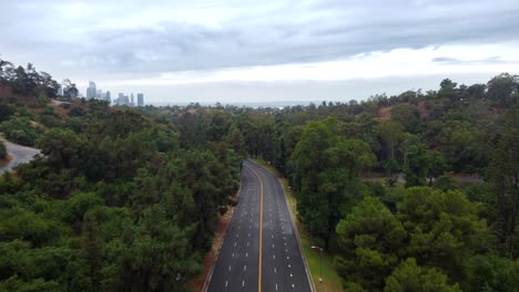 Drone-shot-flying-over-Stadium-Way-road-in-Elysian-Park-in-Los-Angeles
