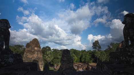 Angkor-temple-guardian-lions-overlook-sacred-lands-at-the-onset-of-Monsoon-season