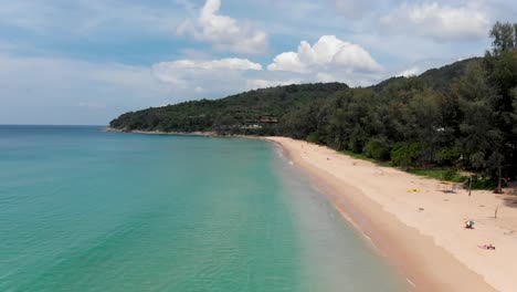 An-aerial-drone-shot-of-the-long-stretch-of-white-sand-in-Nai-Thon-Beach-located-in-Phuket-island,-in-the-south-of-Thailand