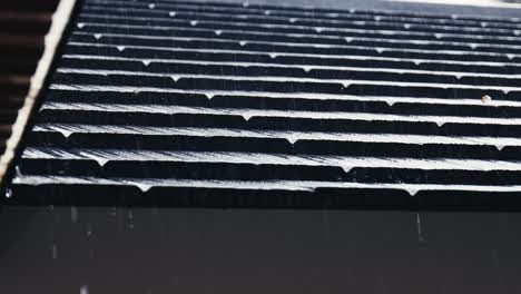 Rain-is-trickling-down-from-the-eaves-and-roof-tiles-of-a-house