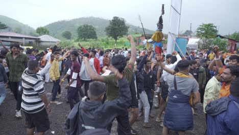 The-crowd-of-Hindu-pilgrims-and-devotees-dancing-and-celebrating-the-holy-month-of-Shravana,-Trimbakeshwar