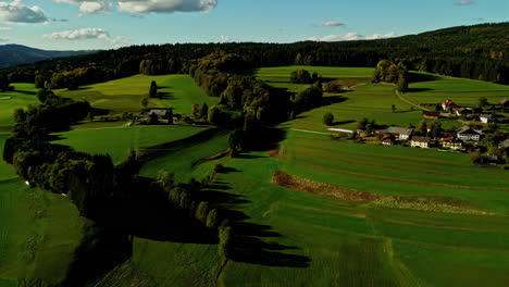 Aerial-footage-of-the-green-landscape-and-farmlands-in-the-countryside-of-the-Austria