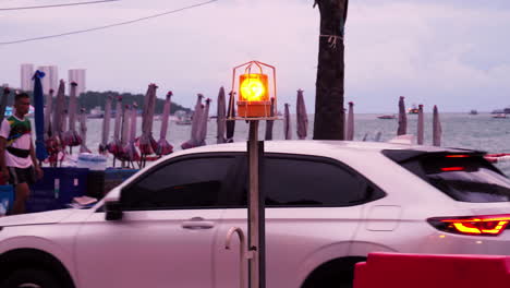 Traffic-situation-near-the-beachfront-facing-the-Gulf-of-Thailand-located-in-Pattaya,-Chonburi-province,-Thailand